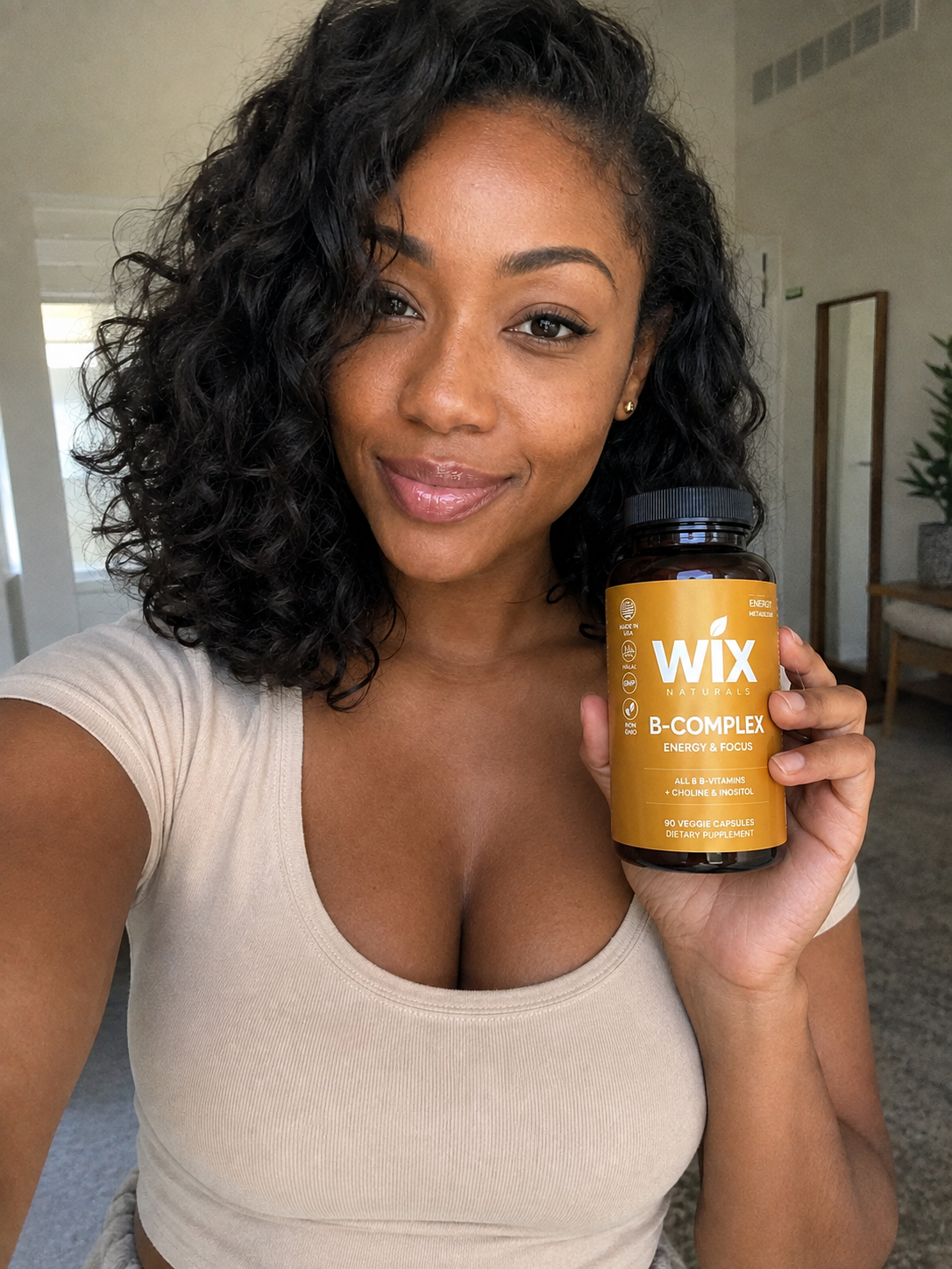 Alyssa holding WIX Naturals B-Complex between appointments