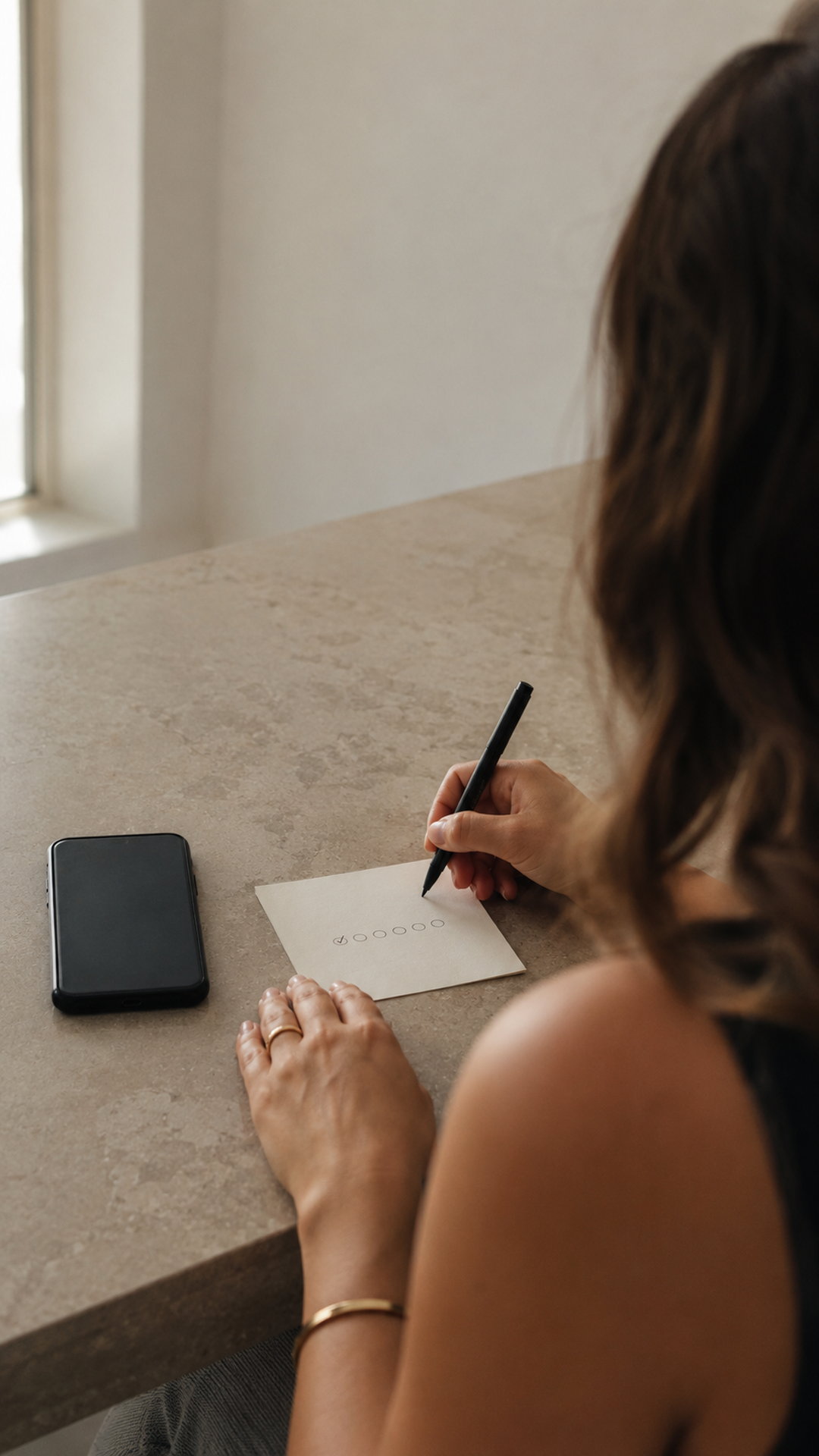 A quiet daily promise written beside a phone